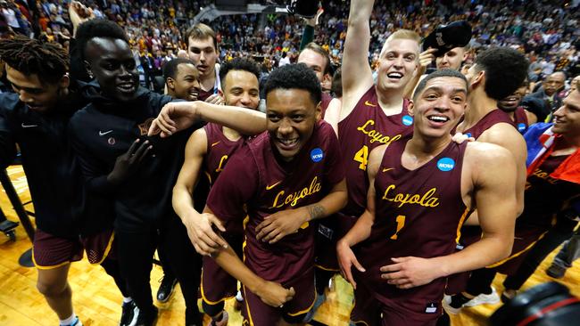 The Loyola Ramblers celebrate after defeating the Kansas State Wildcats.