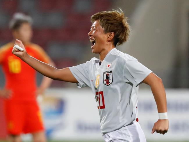 Japan forward Kumi Yokoama celebrates in the semi-final against China.