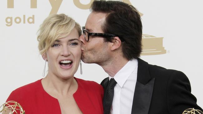 Kate Winslet, left and Guy Pearce with their Emmys for Mildred Pierce. Picture: AP Photo/Jae Hong