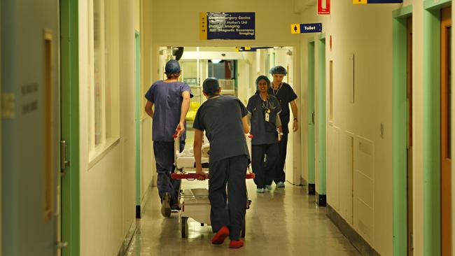 A child is wheeled into surgery. Picture: News Limited