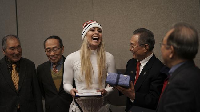 Lindsey Vonn smiles as she receives gifts and a letter of appreciation for her grandfather's service during the Korean War from members of the Yongsan Club in Jeongseon, South Korea. Photo: AP