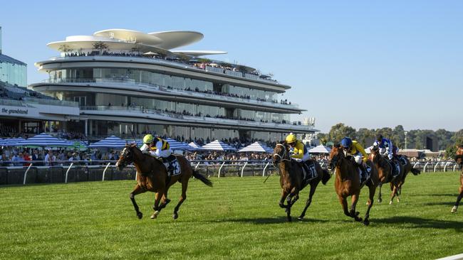 MELBOURNE, AUSTRALIA - MARCH 30: Michael Dee riding Mark Twain winning race 9, the Lexus Roy Higgins during Melbourne Racing at Flemington Racecourse on March 30, 2024 in Melbourne, Australia. (Photo by Vince Caligiuri/Getty Images)