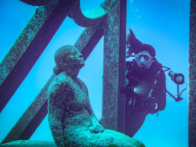 Discover underwater art installations by sculptor Jason deCaires Taylor at John Brewer Reef, Museum of Underwater Art (MOUA).