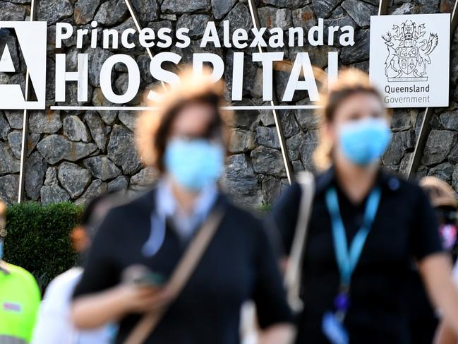 BRISBANE, AUSTRALIA - NewsWire Photos - April 14, 2021. People wear masks as they leave the Princess Alexandra (PA) Hospital in Brisbane. A section of the hospital has undergone further deep cleaning today after traces of COVID-19 were detected.Picture: NCA NewsWire / Dan Peled