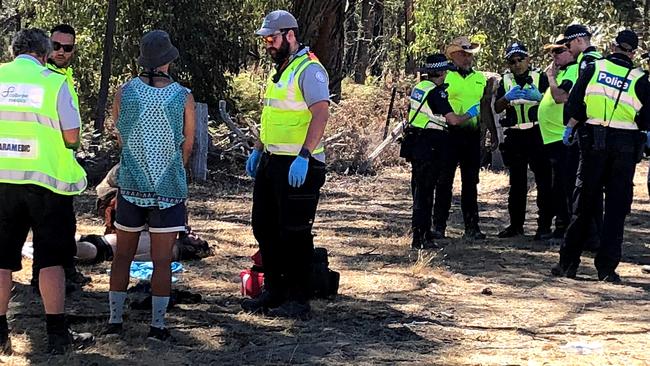 Emergency services help a distressed young man at the Rainbow Serpent Festival.