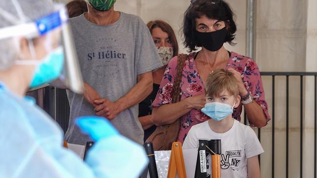 Mum Sharon Warner with her son Chase, 8, wait to be tested. Picture: Alex Coppel.