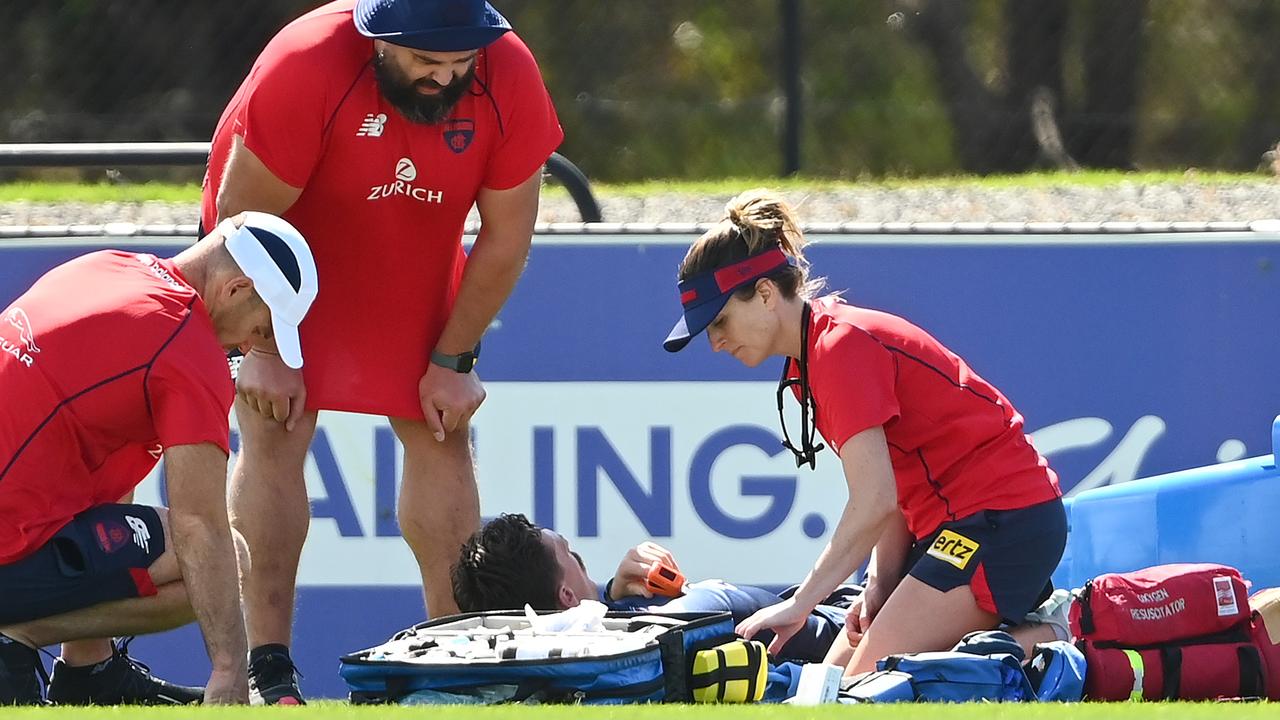 Medical staff attend to Jake Lever after he fainted during a training session. Picture: Getty Images