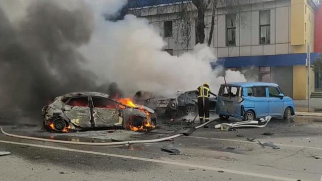 Firefighters extinguish flames after shelling in Belgorod. Picture: AFP.