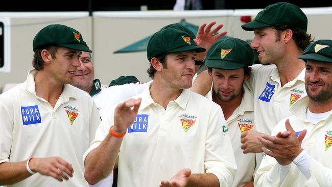 Adam Griffith, second from right, celebrates the 2006-07 Pura Cup final victory with teammates, from left, Luke Butterworth, Jason Krezja, Ben Hilfenhaus and Michael Di Venuto.