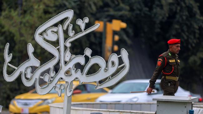 An Iraqi soldier walks past a Ramadan sign in the Karrada district of the capital Baghdad last week. Picture: Ahmad al-Rubaye / AFP