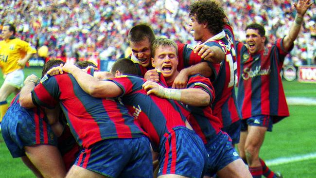 The Newcastle Knights celebrate their incredible 1997 premiership win against Manly. Picture: AAP Images