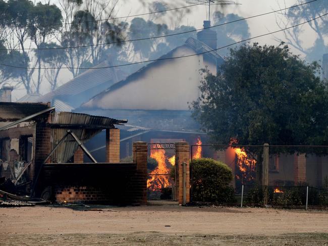 A house burns near Wasleys after the firefront moved through. Picture: Calum Robertson