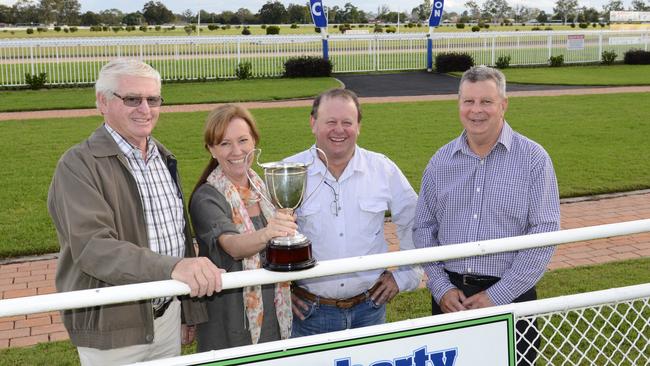 Paul and Margy Dougherty (centre), owners of Dougherty Constructions at the races in the 2010s.