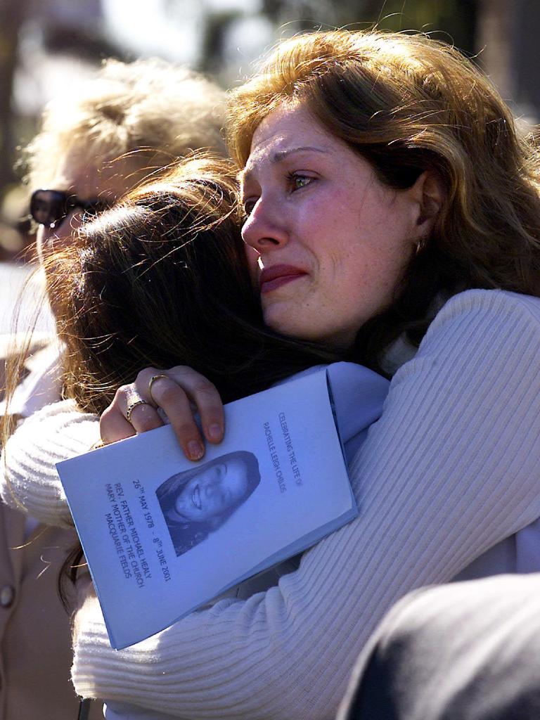 Friends comfort each other at the funeral of Rachelle Childs. Picture: Troy Bendeich