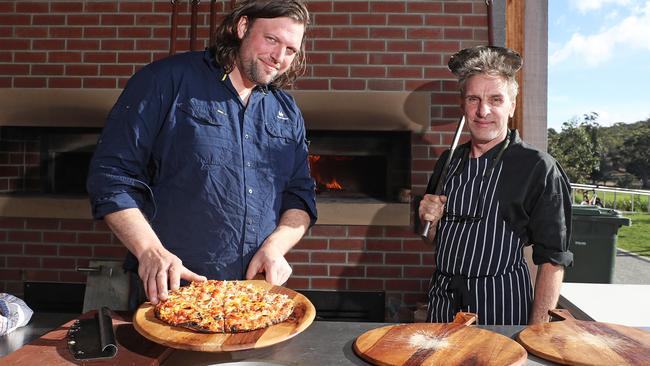 Chefs Andrew Clark, left, and Adrian Mathews at a wood-fired ovens public baking day on the Queens Domain in Hobart. Picture: LUKE BOWDEN