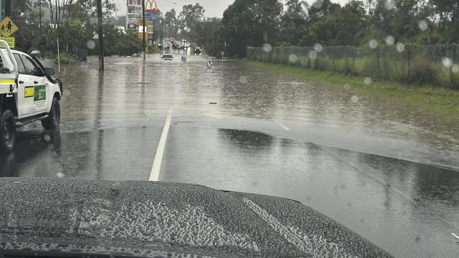 Floodwaters on Siganto Drive, Helensvale after heavy weekend of rain. Photo: Facebook/Andy Hampton