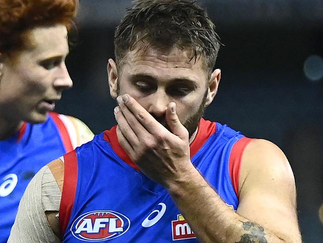 MELBOURNE, AUSTRALIA - AUGUST 08: Marcus Bontempelli and Caleb Daniel of the Bulldogs look dejected after losing the round 21 AFL match between Western Bulldogs and Essendon Bombers at Marvel Stadium on August 08, 2021 in Melbourne, Australia. (Photo by Quinn Rooney/Getty Images)