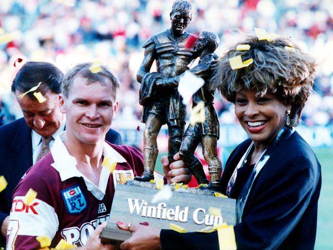 Alfie Langer and Tina Turner holding the Winfield Cup at the end of the 1993 Brisbane Broncos v St George Rugby League Grand Final at the SFS in Sydney.