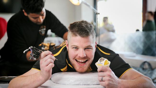 Ryan Wilhelm celebrates Richmond’s premiership win by getting inked at The Inkredible Parlour. Picture: Danella Bevis/The West Australian