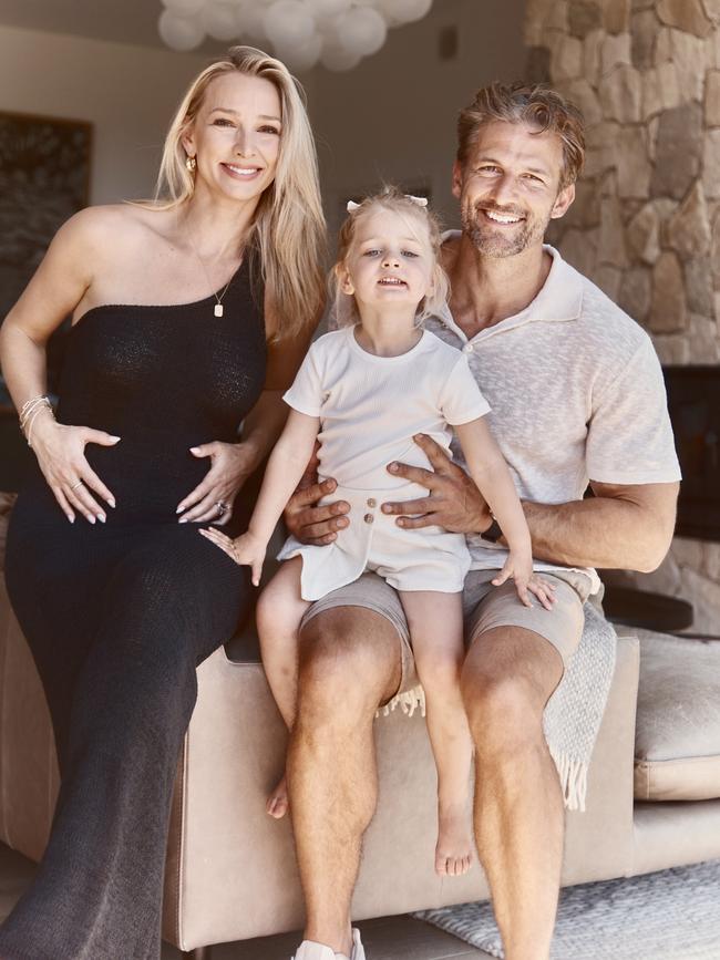 Anna Heinrich and Tim Robards with their daughter Elle announcing they’re expecting their second child.