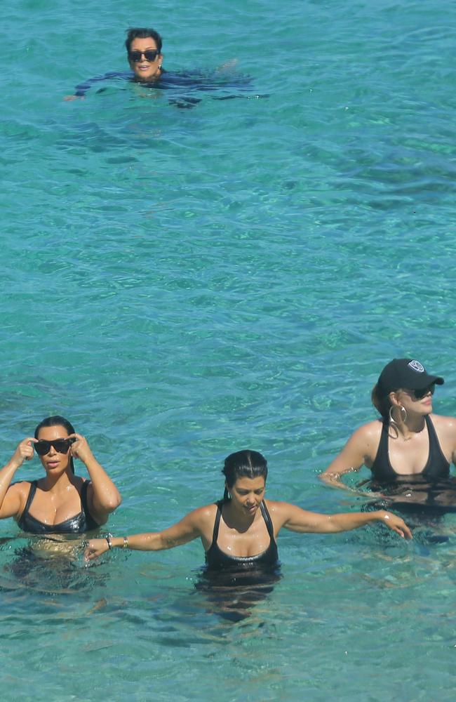 All four ladies cooled off in the ocean after their walk.