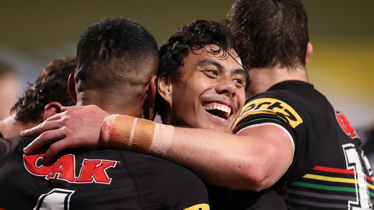 Jarome Luai of the Panthers (centre) celebrates with try-scorer Stephen Crichton.