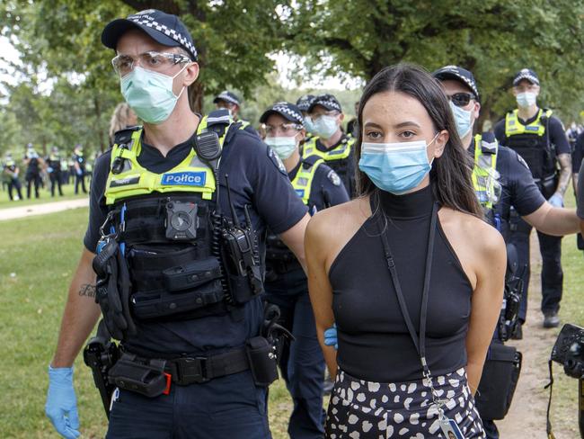 *WARNING - STRICTLY DO NOT PUBLISH BEFORE SPEAKING TO PIC DESK* - MELBOURNE, AUSTRALIA - NewsWire Photos FEBRUARY 20, 2021: Herald Sun Reporter Olivia Jenkins and photographer Jake Nowakowski are arrested at an Anti Vaccination protest at Fawkner Park in Melbourne on Saturday afternoonPicture: NCA NewsWire / David Geraghty