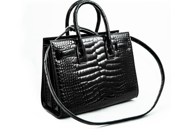 A West Australian woman has learnt an expensive lesson after an alligator handbag valued at more than $26,000 was seized by Australian Border Force on entry to the country., The bag, purchased from a Saint Laurent boutique in France, was confirmed to be alligator skin by the Department of Agriculture, Water and the Environment. SUPPLIED