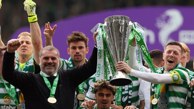 Ange Postecoglou and Celtic captain Callum McGregor with the SPL trophy.