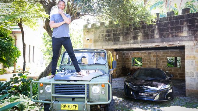 Justin Hemmes with his cars at home in Sydney.