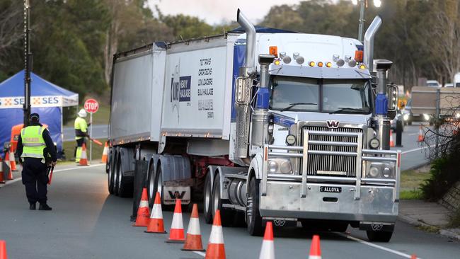 A truck passes through a checkpoint at Coolangatta. Picture: Richard Gosling