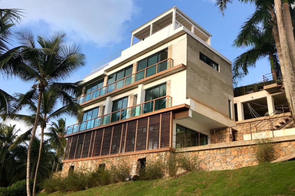 The gated, guarded, four-storey home is made of natural materials. Picture: Airbnb