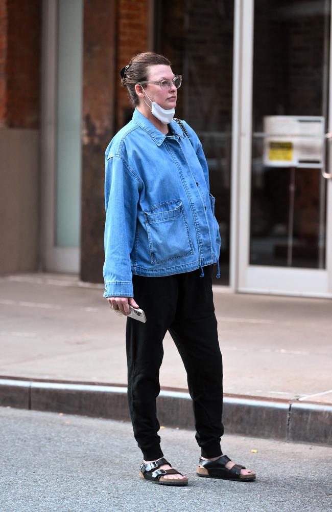 Linda, who went makeup free, completed the look with a pair of wide-rimmed glasses, Birkenstock sandals and a black bag. Picture: Splash News/Media Mode