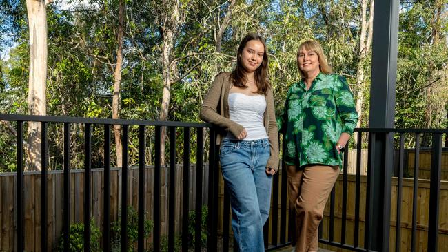 Melissa Beh with daughter Olivia at 'The Orchard' development in Arana Hills where she has bought a townhome. Picture: Richard Walker.