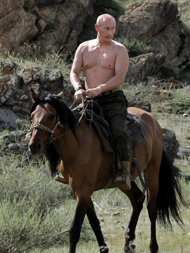 Bare-chested Vladimir Putin rides a horse in Southern Siberia.