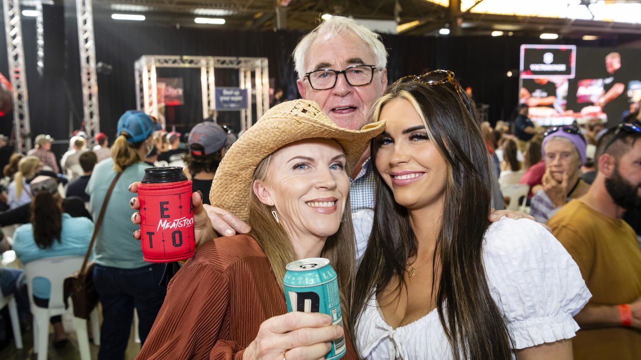 Rayna Gillies (left) and Taylah Gillies get photobombed by Toowoomba Regional Council Mayor Paul Antonio at Meatstock at Toowoomba Showgrounds, Friday, April 8, 2022. Picture: Kevin Farmer