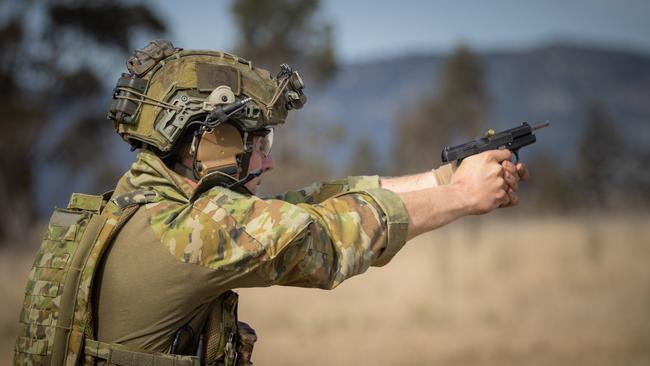 An Australian army soldier from the 3rd Battalion, Royal Australian Regiment, engages a target with a 9mm pistol during combat shooting serials conducted as part of the 2022 Duke of Gloucester Cup held in Singleton. *** Local Caption *** Australian Army infantry soldiers from across Australia tested their core skills for the prestigious Duke of Gloucester Cup at the School of Infantry, near Singleton in NSW, July 31 - August 5 2022. The Duke of Gloucester Cup is the Armyâ€™s premier military skills competition, pitting the best Royal Australian Corps of Infantry rifle sections from each unit against one another through a series of challenging activities that test their core infantry skills, including marksmanship, tactics, teamwork and fitness. Along with the Duke of Gloucester Cup, five other trophies are awarded: Sir Arthur MacDonald Trophy for best foundation war-fighting skills; Gurkha Trophy for best live-fire shooting; Royal Ulster Rifles Trophy for best falling plate shooting; OSCMAR Trophy for best battle endurance; and the DSM Roche CSC Memorial Cup for best individual soldier. The Duke of Gloucester Cup was created by Prince Henry, Duke of Gloucester, in 1946, while serving as the Governor-General of Australia.