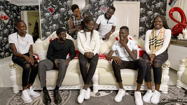Awur Deng, 18, lives at home in Salisbury Plain with nine siblings including, from left, Akur Ayuen Deng (12), Deng Leek Aleer (19), Anyuat Ayuen Deng (13) and Atong Ayuen Deng (15) and parents Adut Aleer Deng and Solomon Ayuen Deng. Picture: Naomi Jellicoe