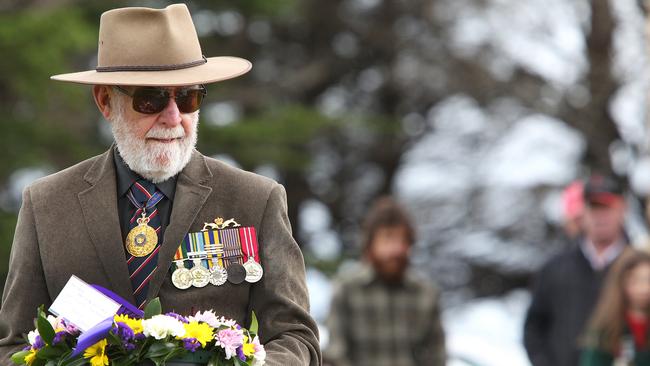 Vice Admiral (retired) Ian MacDougall lays a wreath at the Marrawah ANZAC Day service in 2016.