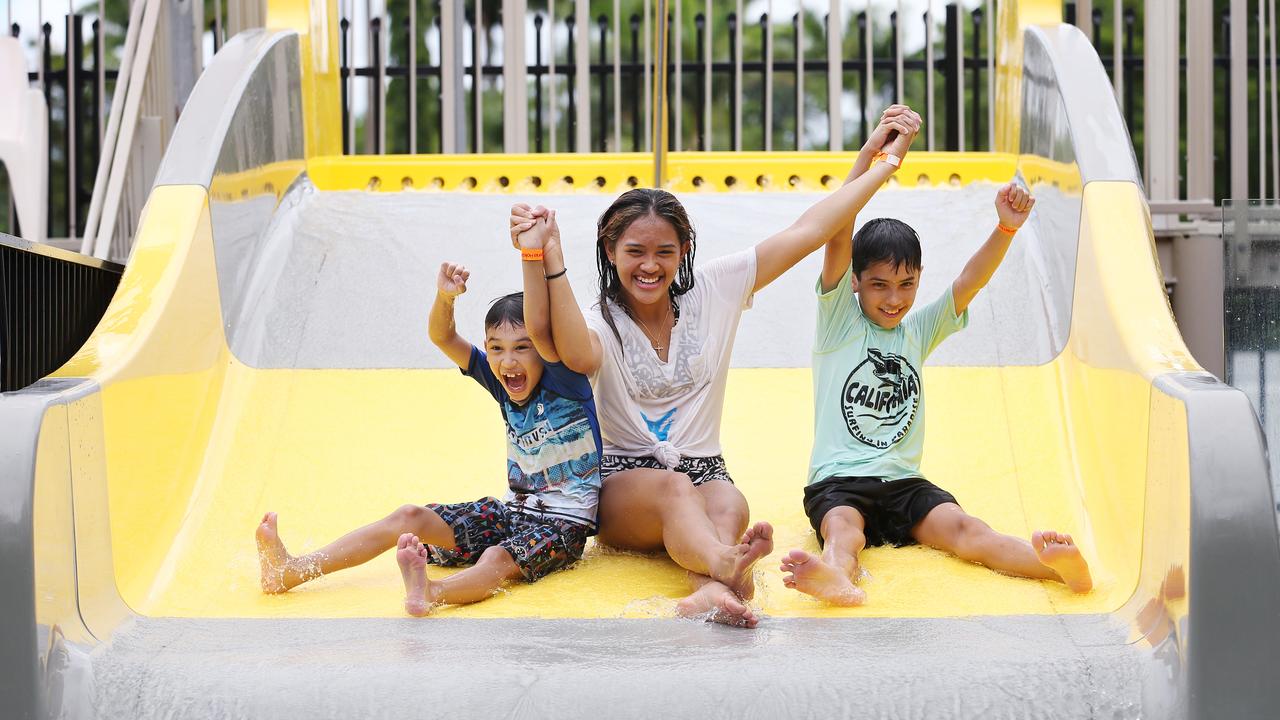 Siblings Ethan Campbell, 7, Elaiza Campbell, 14, and, Kevin Campbell, 10, enjoy the water slides at the BIG4 Ingenia Holidays Cairns Coconut Tourist Park, Woree, where they holiday every year with their parents. Picture: Brendan Radke.