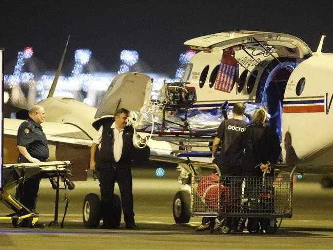 An injured person from an explosion at Grosvenor Mine at Moranbah pictured arriving at the Royal Flying Doctors Service in Brisbane on May 6, 2020. This is the second flights to arrive after an explosion at the mine left five people seriously injured. Picture: Josh Woning/AAP)