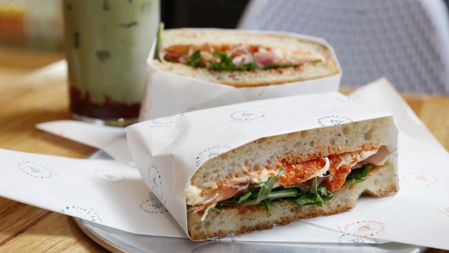 Happy Larry’s delicious prosciutto sandwich includes two slabs of fluffy focaccia stuffed with paper-thin prosciutto, vibrant rocket, chunky red capsicum sauce and a creamy burrata. Picture: Nikki Davis-Jones