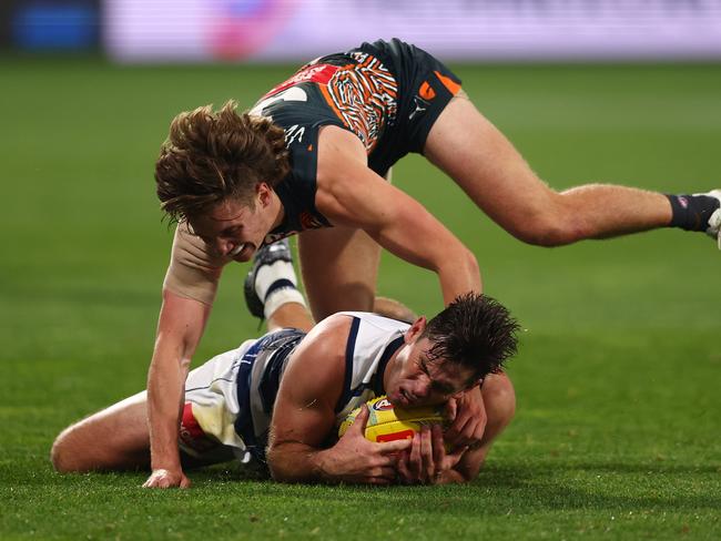 Tom Hawkins slides to mark in his record-breaking game. Picture: Graham Denholm/Getty Images