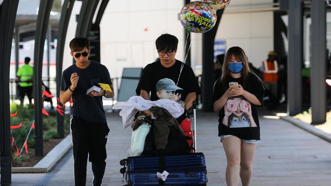 Travellers at Sydney International Airport arrivals terminal after a Cathay Pacific flight from Hong Kong. Picture: Gaye Gerard