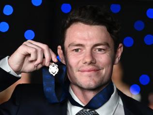 BRISBANE, AUSTRALIA - OCTOBER 18: Lachie Neale of the Lions poses with the Brownlow medal at the Gabba during the 2020 AFL Brownlow Medal count on October 18, 2020 in Brisbane, Australia.  (Photo by Quinn Rooney/Getty Images)