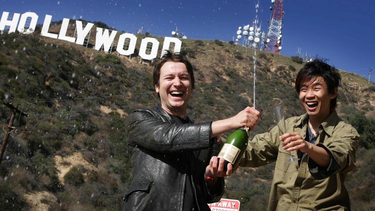 Leigh Whannell (L) &amp; James Wan in front of famous Hollywood sign in the Los Angeles Hills as they celebrate their success of their 2004 film Saw. Picture: Karen Dodd.