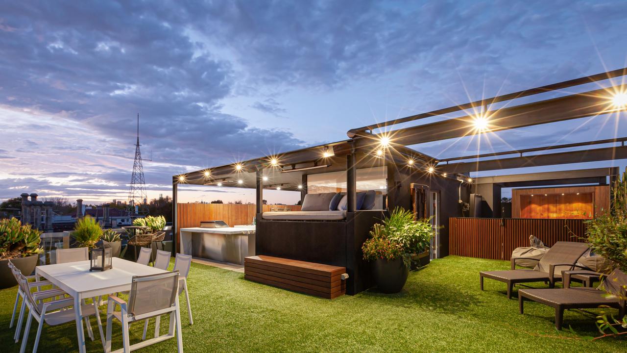 Floor-to-ceiling glass captures uninterrupted views over Port Phillip Bay, Luna Park and the city skyline.