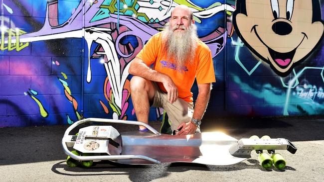 Adrian Alderson celebrating his shop CRE8IVE SK8 20th anniversary. Pictured with his Street Luge Board.