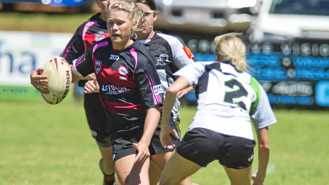 BIG RUN: Toowoomba Valleys Fillies player Kirilee Sires takes on the Souths-Logan defence. The Fillies lost thier season opener 18-16. Picture: Nev Madsen