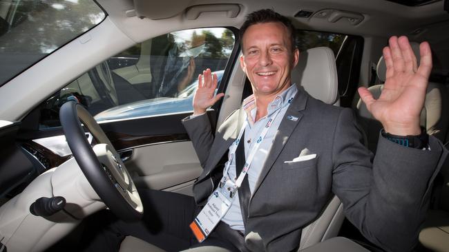 No hands! Volvo’s Trent Victor behind the steering wheel of the driverless car. Photo: Jo-Anna Robinson